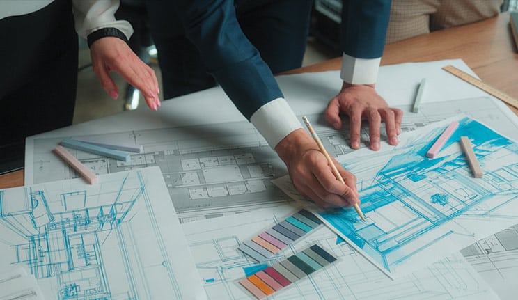 Architects working on building plans