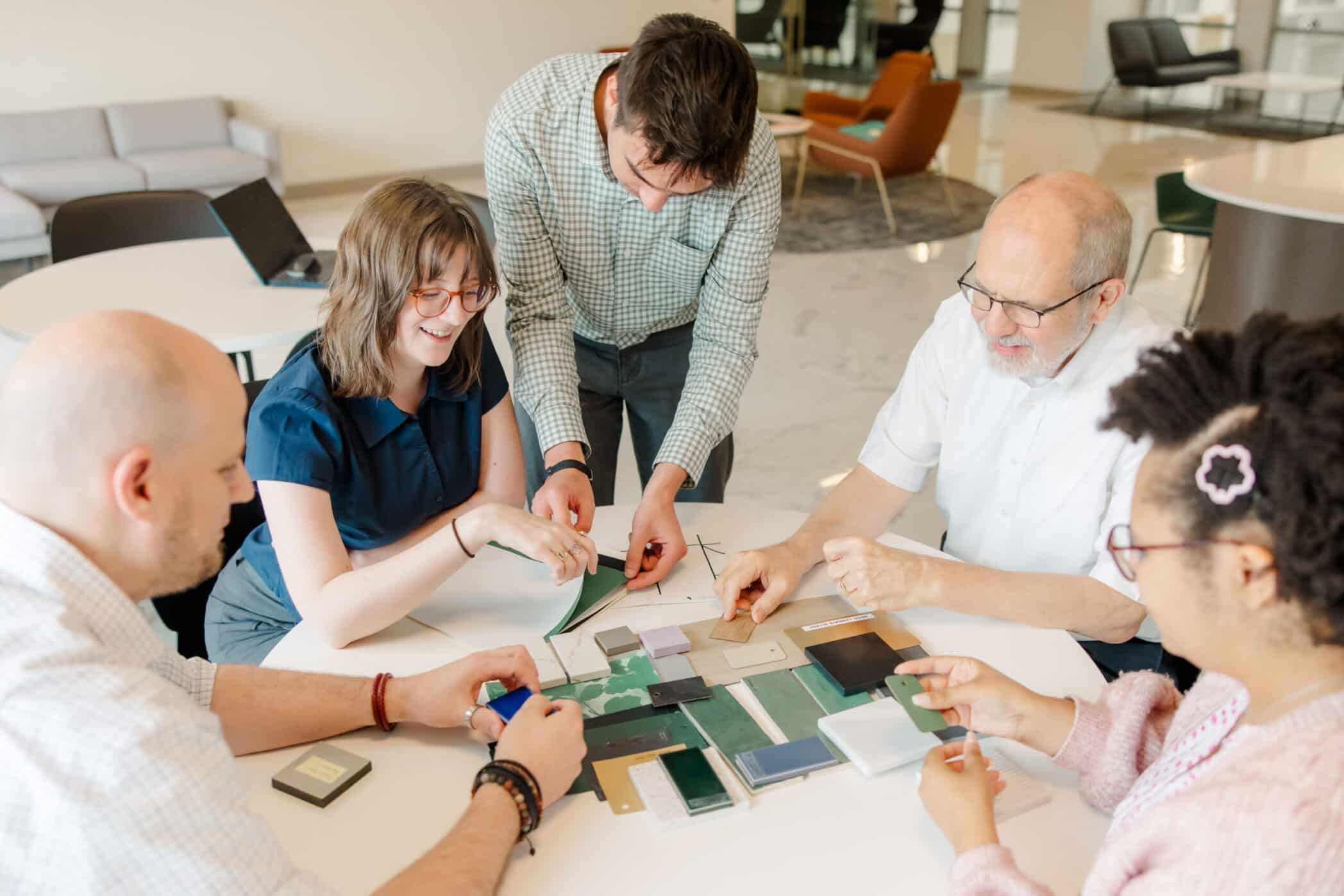 Cole & Denny employees looking at building plans